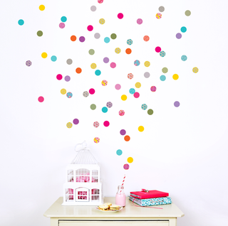 colorful polka dots on white wall