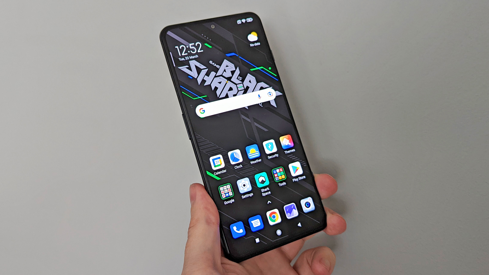 Xiaomi Black Shark 4 Pro being held in a hand, showing the front