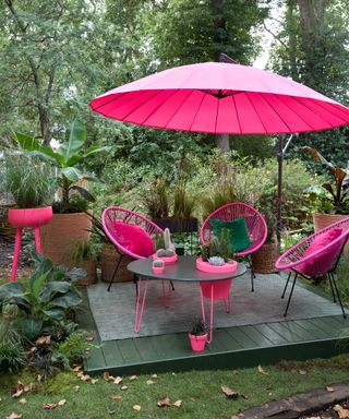 pink parasol over small decking at Malvern Garden Buildings stand at Chelsea 2021 – 'The Green Room' designed by Ian Drummond