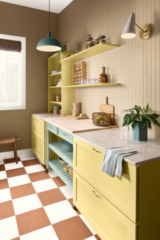 Kitchen with yellow cabinetry and orange checkerboard floors