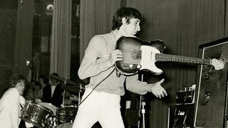 Pete Townshend of The Who smashes a Fender Telecaster guitar into the speaker cab of his amplifier during a concert at the Oberrheinhalle, Offenburg, Germany, 17th April 1967. Singer Roger Daltrey is behind him on the left. Marshall amplifier heads are visible behind the speaker cabs and the guitar is fitted with a Fender Stratocaster neck
