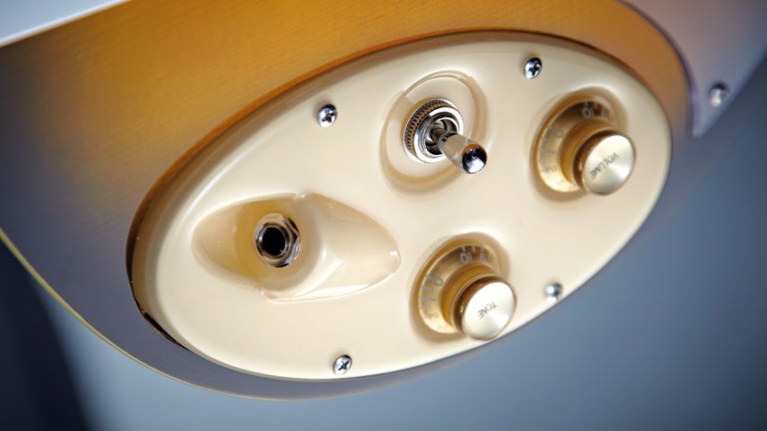 The cream plastic control plate is height and angle adjustable
