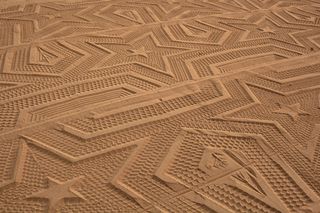 Swedish artist Gunilla Klingberg used a mechanical device to create this graphic star pattern on Laga beach