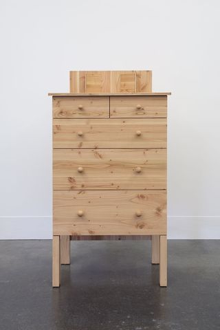 Four drawer wooden chest of drawers
