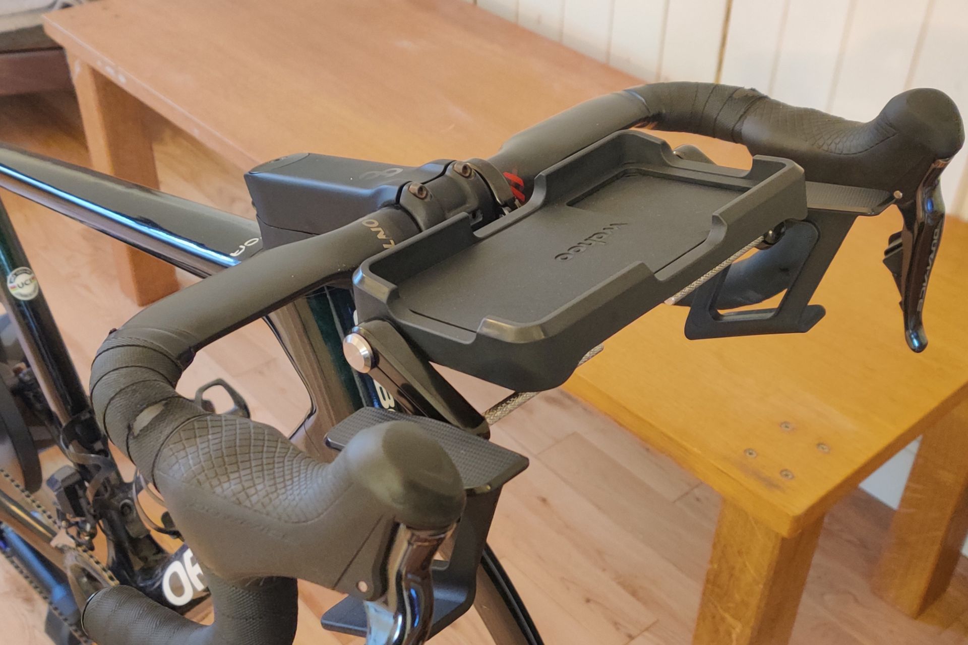 Image shows a rider using Wahoo's new Kickr Steer on the updated RGT cycling platform