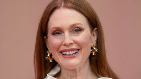 julianne moore on a pink background