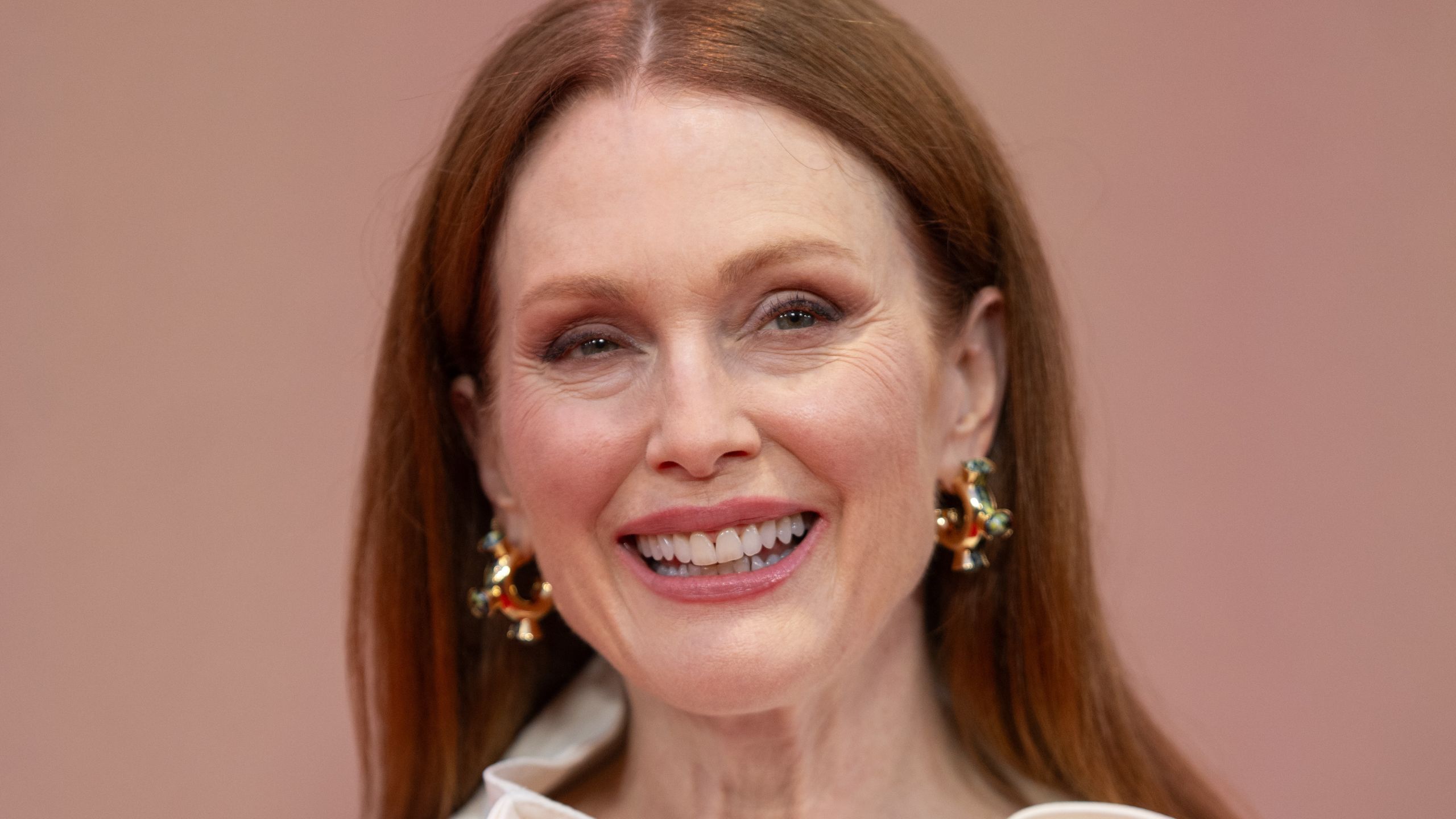 julianne moore on a pink background