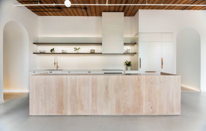 a modern kitchen lit by strip led lighting