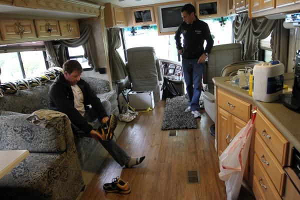 Staff prepare for the day inside the HTC-Columbia team bus.