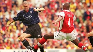 Manchester United's Roy Keane and Arsenal's Patrick Vieira compete for the ball in a Premiership match in August 1999.