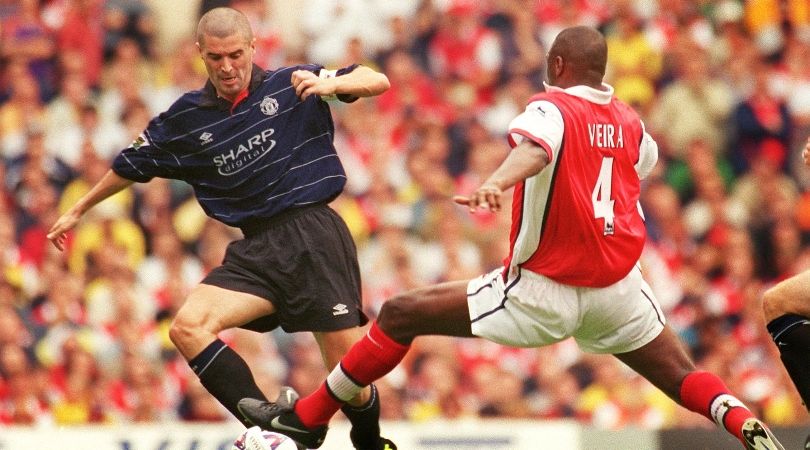 Manchester United&#039;s Roy Keane and Arsenal&#039;s Patrick Vieira compete for the ball in a Premiership match in August 1999.