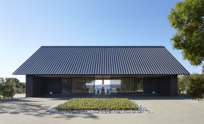 exterior view of property with view straight through to water and mountains in the distance 