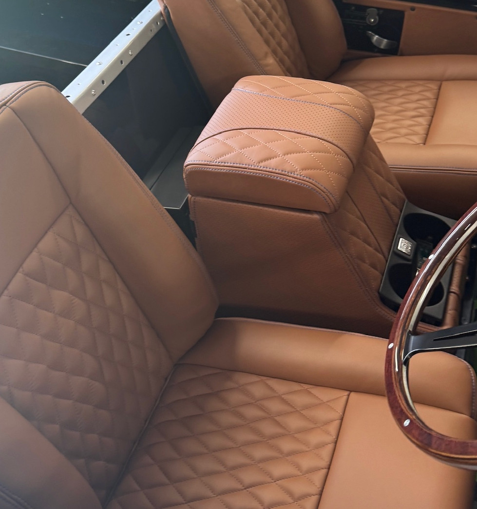 The seats are upholstered in quilted hand-stitched leather