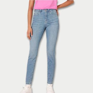 A cutout of a model wearing pale blue skinny jeans