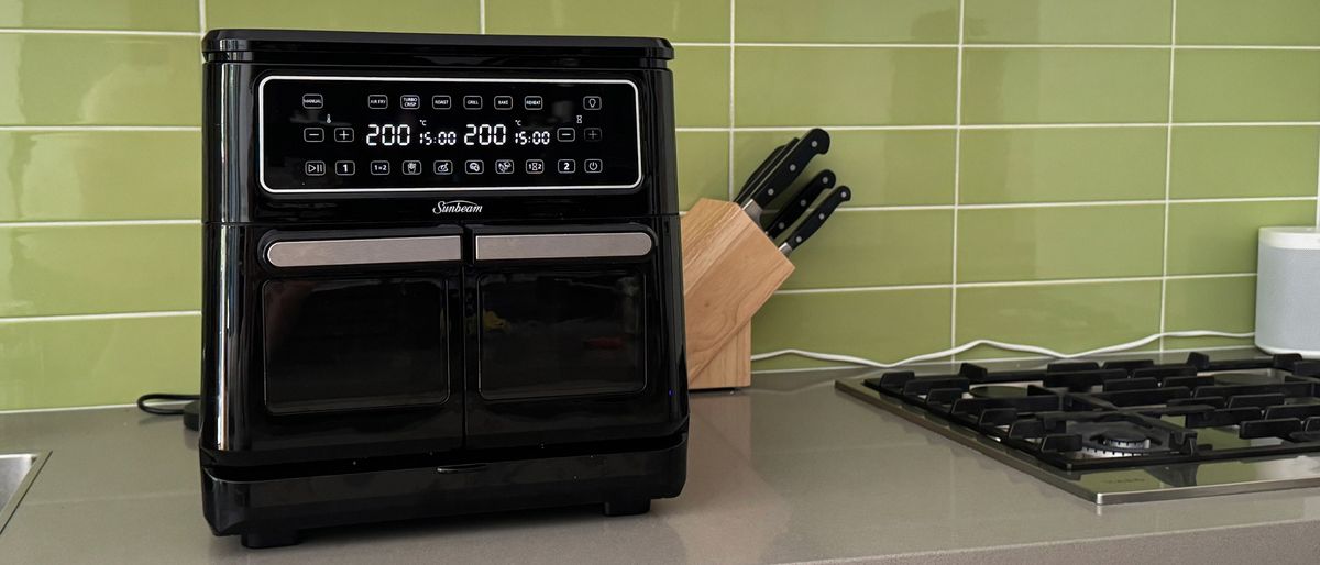 Sunbeam Multi Zone Air Fryer Oven on kitchen counter top, with a knife block in the background