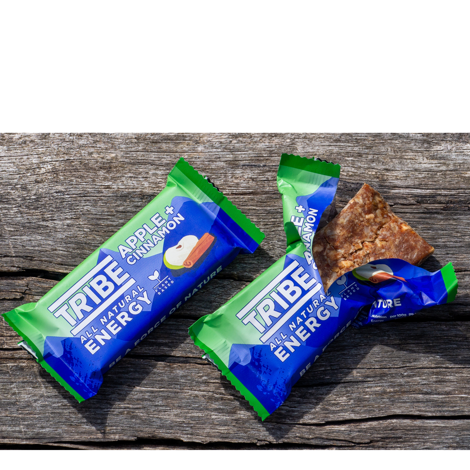 A pair of Tribe energy bars on a wooden bench