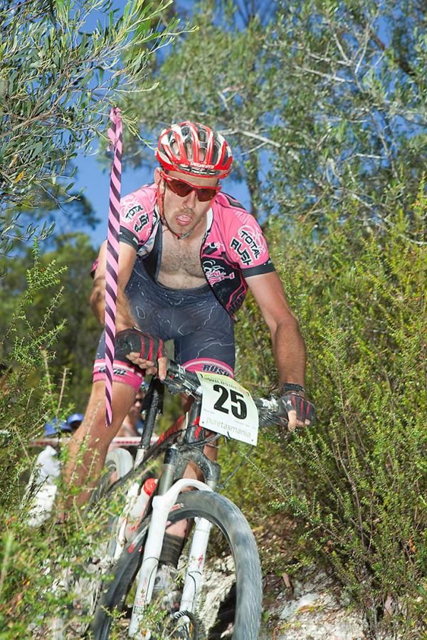 Sam Chancellor of Victoria flies recklessly into the single track section close to the Que River finish.