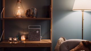 A cosy living room with a bluetooth speaker