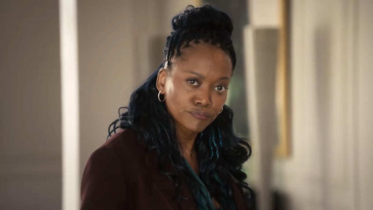 Monica looking into camera in The Fall and Rise of Reggie Dinkins Season 1