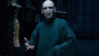 Ralph Fiennes as Voldemort in Order of the Phoenix, holding his wand in his left hand.