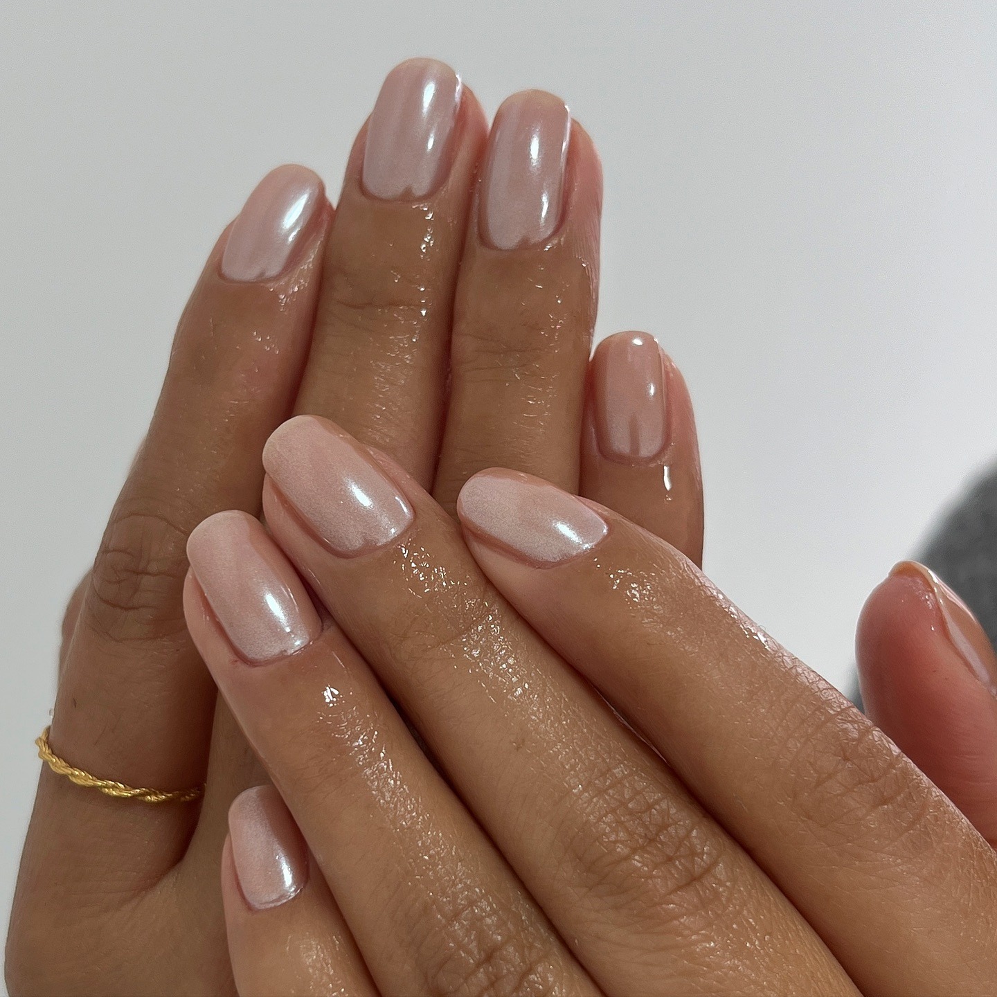 A light brown chrome manicure