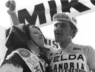 Belgian cyclist Freddy Maertens smiles on the podium after beating Frenchman Jacques Esclassan to the finish line at the end of the 7th stage of the Tour de France in 1976. Maertens finished the Tour with the green jersey of best sprinter after winning a record-tying eight stages.