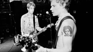 Hillel Slovak (1962 - 1988) (left), on guitar, and American musician Flea (born Michael Balzary), on bass guitar, both of the Rock group Red Hot Chili Peppers, rehearse during a soundcheck before a sold-out performance at the Ritz, New York, New York, December 12, 1986