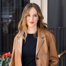 Maya Hawke wears a brown blazer 