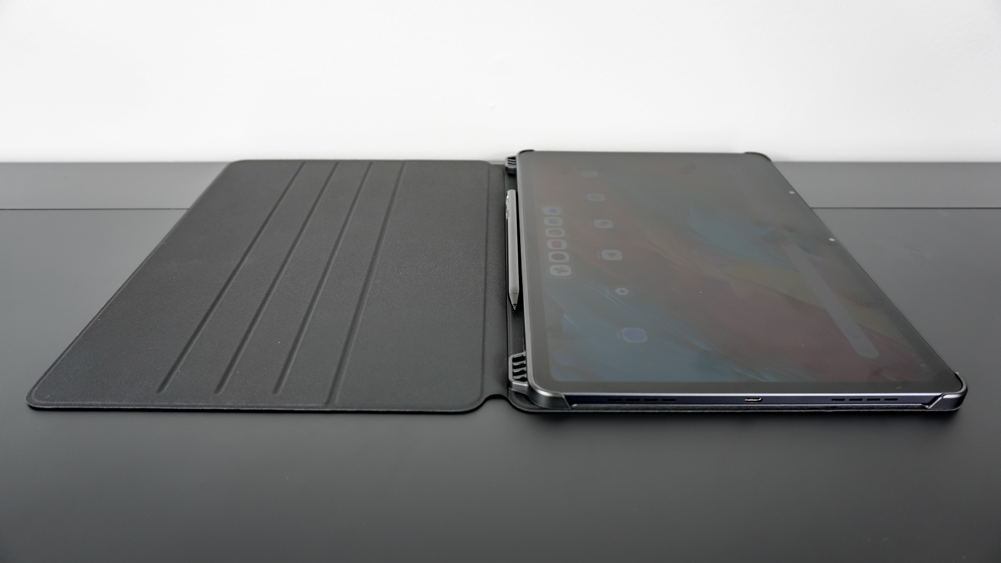 The TCL NXTPAPER 14 in its case open on a desk
