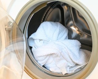 White towels in the washing machine drum