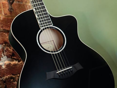 The Taylor Doyle Deluxe sports a high-gloss, jet black finish that you'll either love or hate.