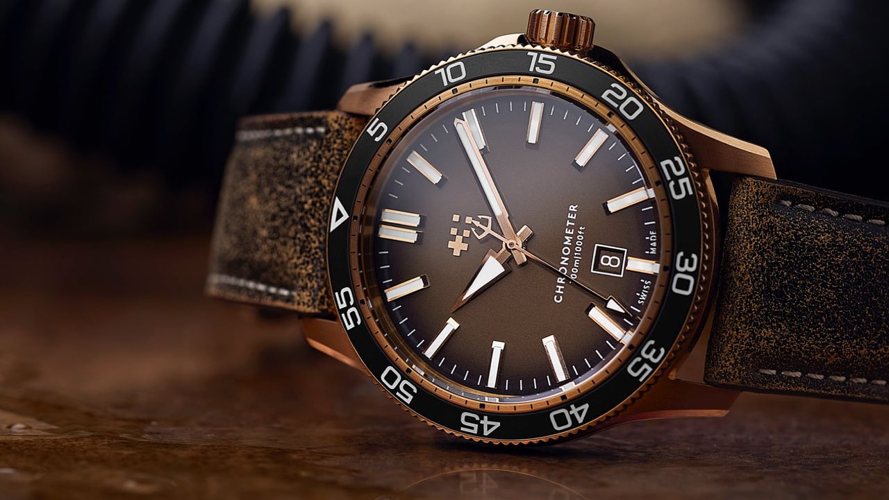 The Christopher Ward C60 Pro 300 Bronze on a brown background