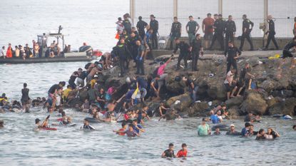 People swim from Morocco to Ceuta, Spain overwhelming authorities