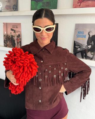 Fashion influencer Vicky Montanari wears the burgundy color trend with bright red.