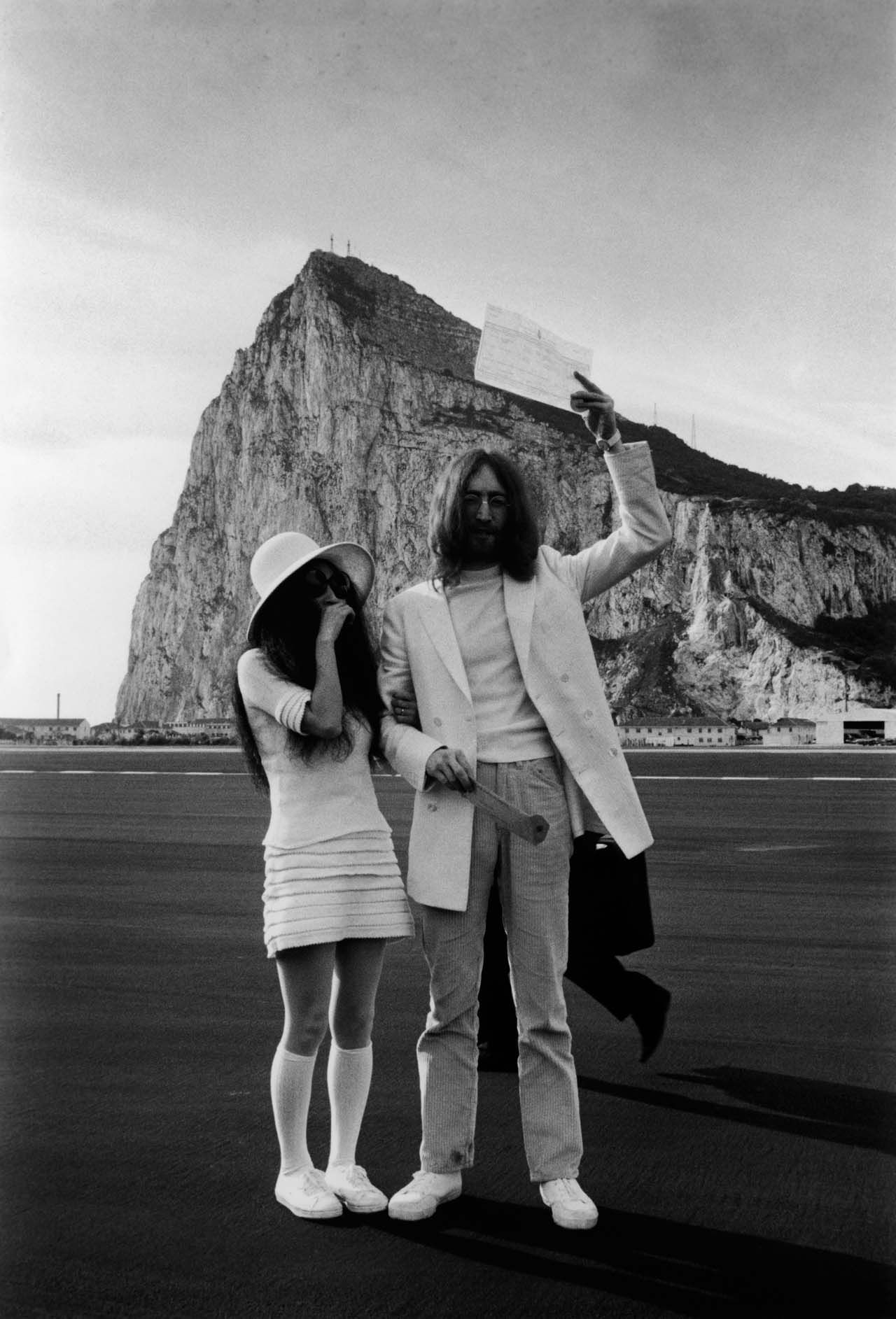 John Lennon and Yoko Ono with their marriage certificate after their wedding in Gibraltar, 20th March 1969.