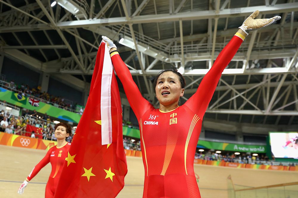 Jinjie Gong (R) and Tianshi Zhong (L) of Team China celebrates winning the gold medal after beating Team Russia in the Women's Team Sprint