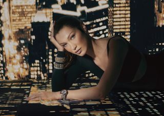 Bella Hadid poses wearing gold and silver jewelry in a Chopard campaign.