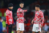 Manchester United trio Jadon Sancho, Mason Greenwood and Cristiano Ronaldo look on prior to the Premier League match between Manchester United and Burnley at Old Trafford on December 30, 2021 in Manchester, England.