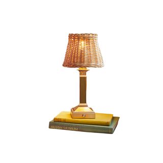 Freya cordless table lamp with an antique stand and a rattan weaved lampshade