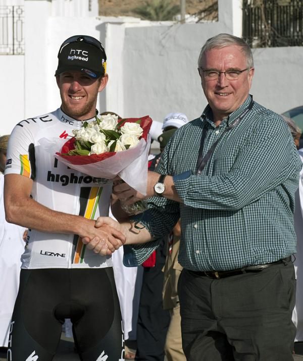 Stage two winner Matt Goss is congratulated by UCI president Pat McQuaid.