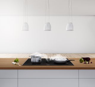 Modern kitchen ideas featuring a Bosch extractor in a white scheme.