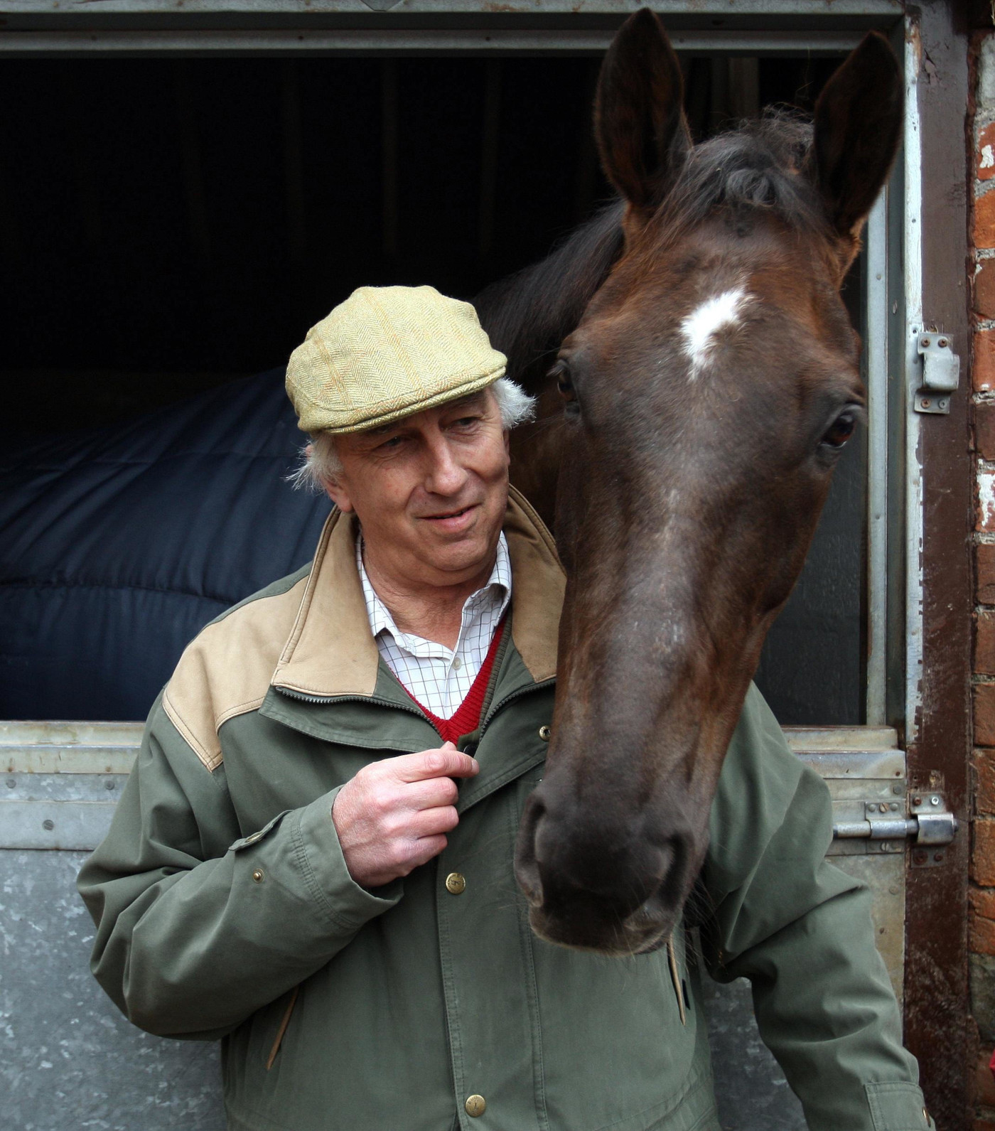 Racehorse owner Paul Barber, pictured here with Gold Cup winner Denman, has died aged 80