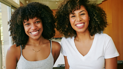 Smile, Jheri curl, Hairstyle, Jewellery, Facial expression, Style, Black hair, Ringlet, Afro, Necklace, 