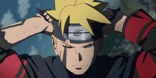 Boruto ties on his headband.