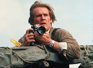 Nick Nolte holding Nikon F2 camera