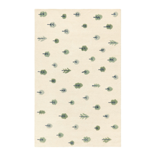 neutral area rug with green leaf motif