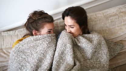 Women under a blanket