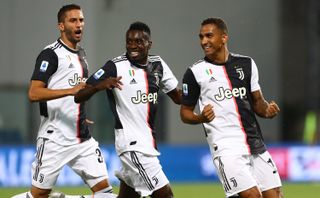 Juventus FC's Danilo (right) celebrates a goal with teammates Blaise Matuidi (center) and Rodrigo Betancur during a recent match. The squad takes on Lazio on July 20.