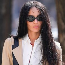 Zo&euml; Kravitz was spotted in New York City wearing a trench coat with her favorite Saint Laurent laptop bag