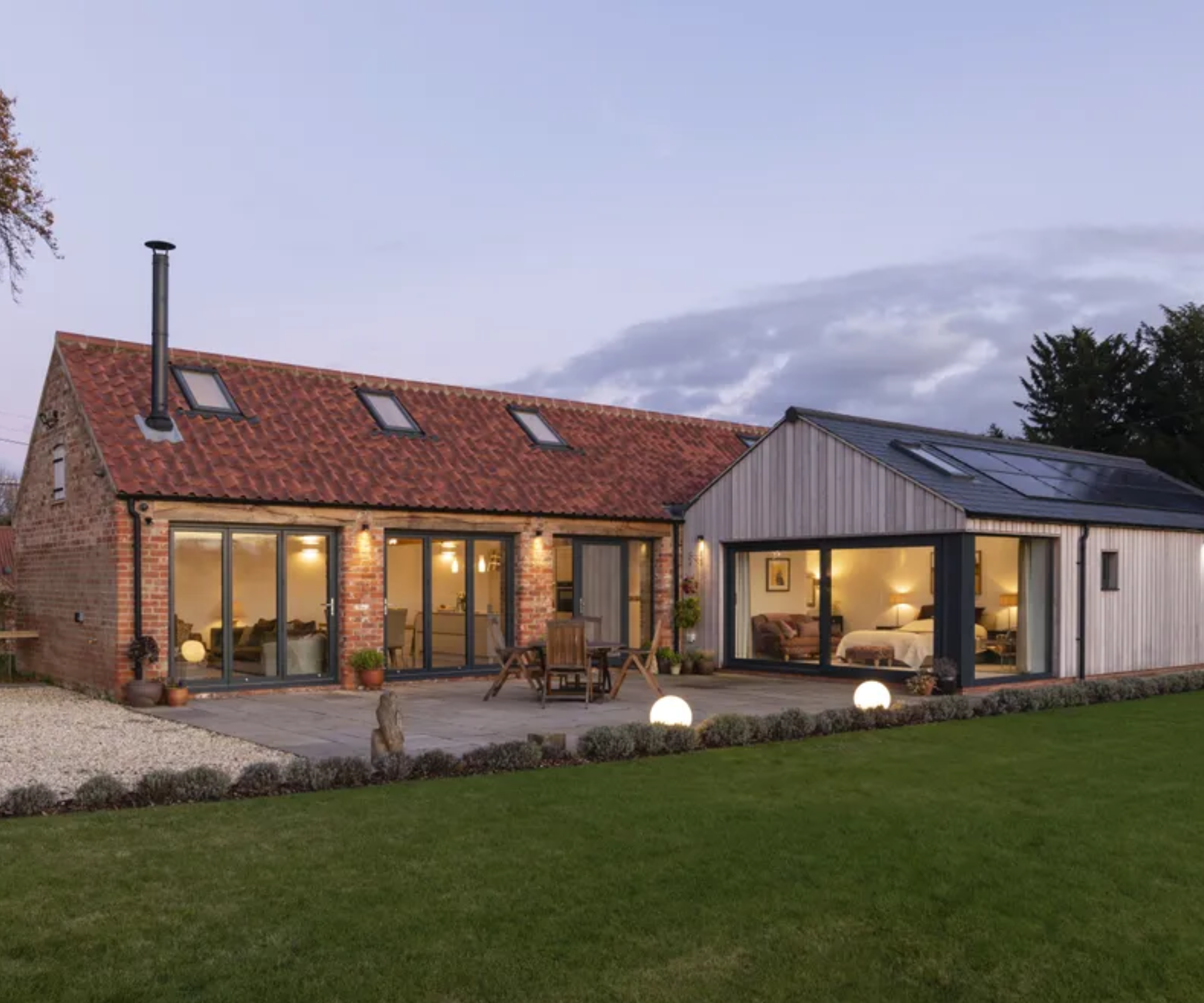 outdoor lighting to illuminate a barn conversion and extension
